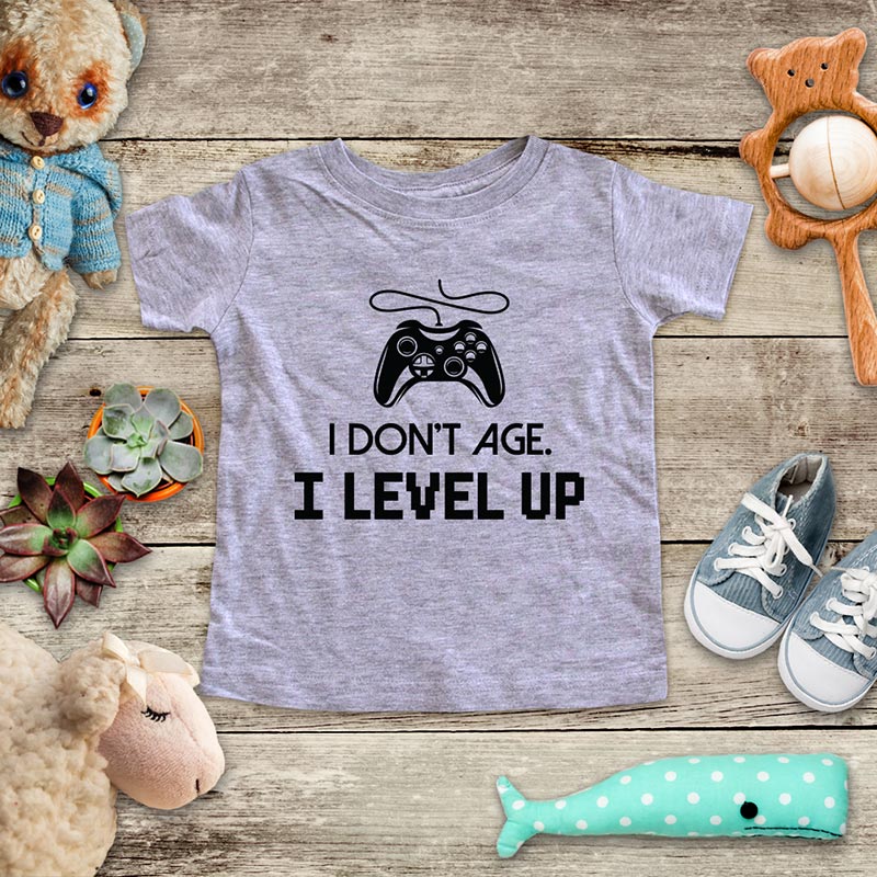 I Don't Age. I Level Up - playing Retro Video game design Baby Onesie Bodysuit, Toddler & Youth Soft Shirt