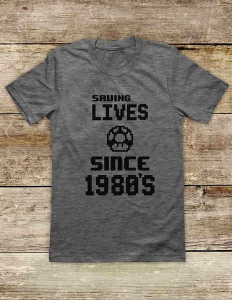 Saving Lives Since 1980's retro vintage Video Game Soft Unisex Men or Women Short Sleeve Jersey Tee Shirt